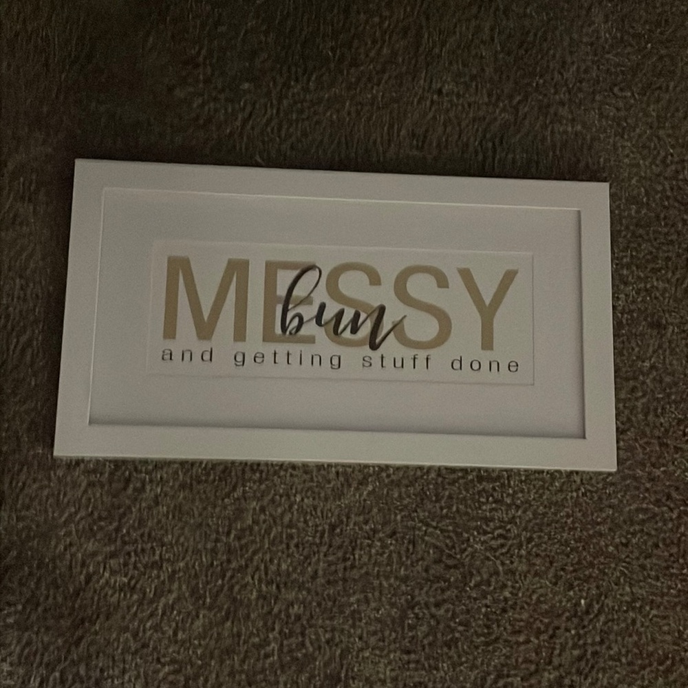 It’s perfect for a girls room.  It says messy bun get things done.